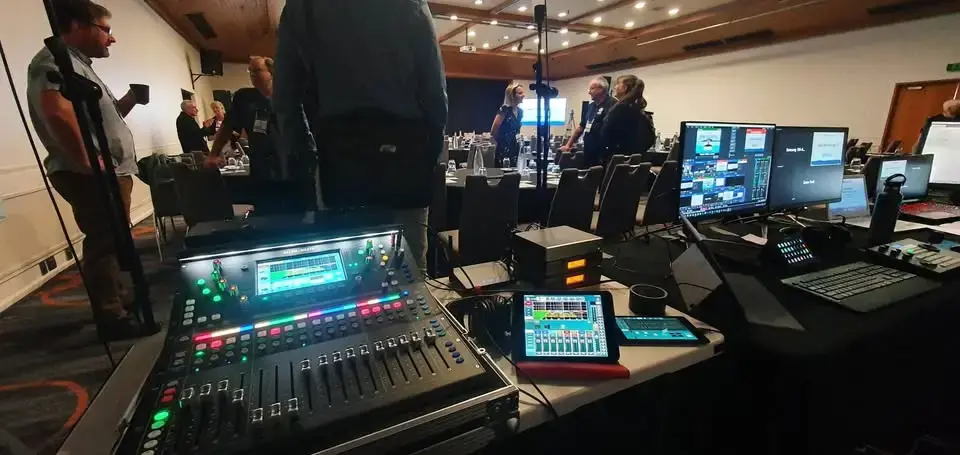 Allen and Heath digital audio desk and vision monitors set up for a conference
