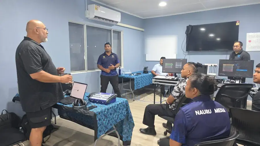 Manaia Go trainer leading a session with Nauru Media staff beside the vision switcher and replay systems